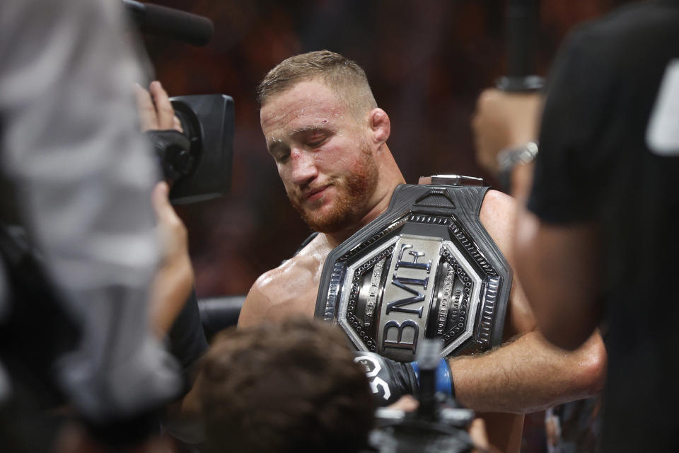 Jul 29, 2023; Salt Lake City, Utah, USA; Justin Gaethje (blue gloves) reacts to defeating Dustin Poirier (red gloves) during UFC 291 at Delta Center. Mandatory Credit: Jeff Swinger-USA TODAY Sports