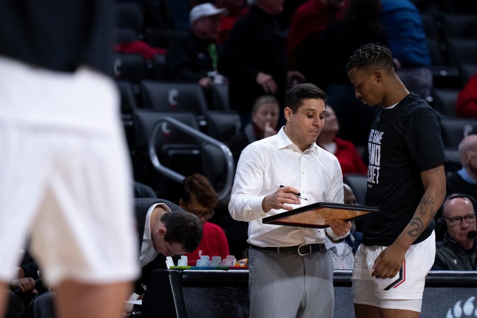 Coach Wes Miller and senior Landers Nolley II are shooting for the Bearcats' third straight victory when they play Memphis Sunday in the final regular-season road game.