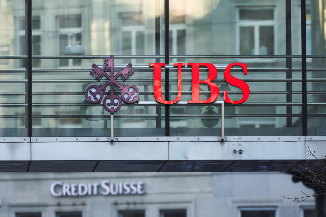 FILE PHOTO; Logos of Swiss banks UBS and Credit Suisse are seen in Zurich, Switzerland March 20, 2023. REUTERS/Denis Balibouse/File photo
