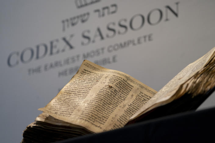 FILE - Sotheby's unveils the Codex Sassoon for auction, Wednesday, Feb. 15, 2023, in the Manhattan borough of New York. The 1,100-year-old Hebrew Bible that is one of the oldest surviving biblical manuscripts sold for $38.1 million, which includes the auction house's fee, Wednesday, May 17, 2023, in New York. (AP Photo/John Minchillo, File)