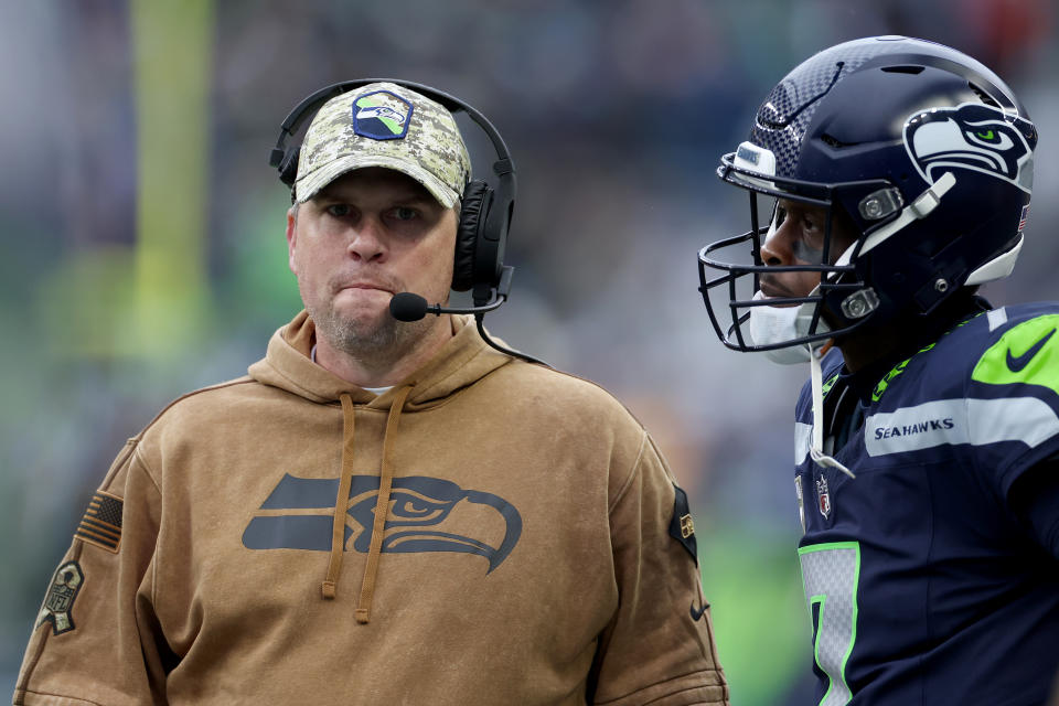 SEATTLE, WASHINGTON – NOVEMBER 12: Offensive coordinator Shane Waldron of the Seattle Seahawks talks to Geno Smith #7 of the Seattle Seahawks during the second quarter against the Washington Commanders at Lumen Field on November 12, 2023 in Seattle, Washington. (Photo by Steph Chambers/Getty Images)
