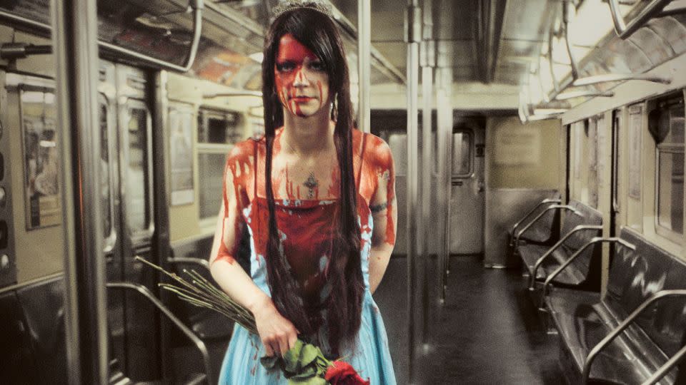 While a bloodied prom queen lurks on an empty train carriage. - Seymour Licht