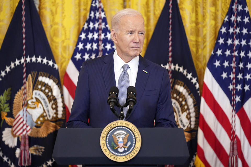 Biden president podium american flag usa us (Evan Vucci / AP)