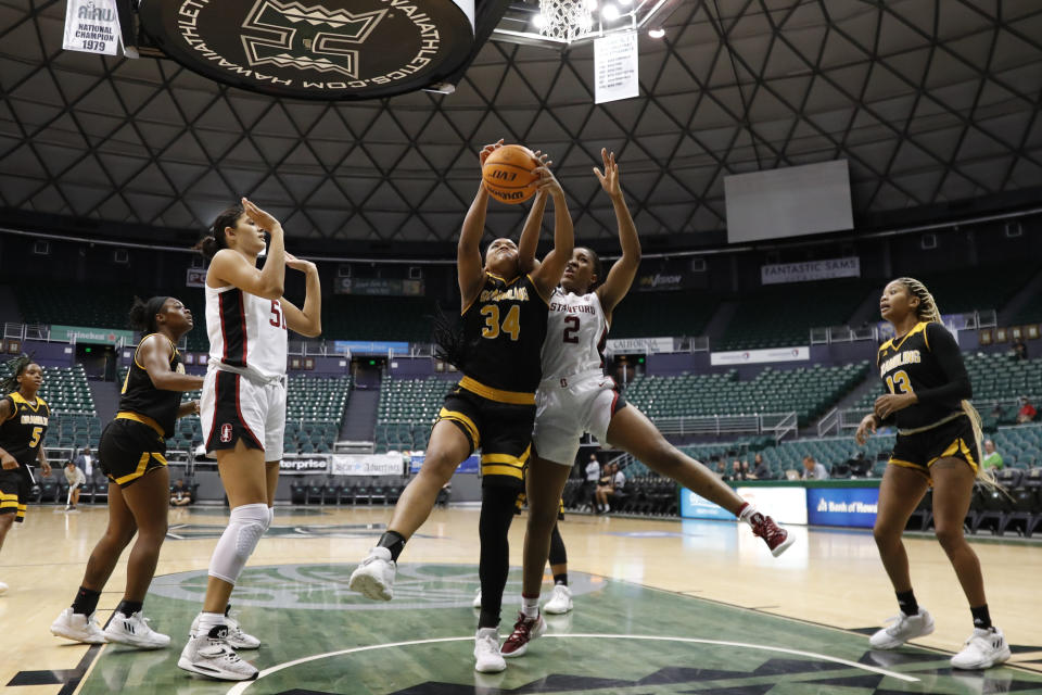 Grambling State center Amanda Blake (34) grabs a rebound over Stanford guard Agnes Emma-Nnopu (2) rebound during the fourth quarter of an NCAA college basketball game, Saturday, Nov. 26, 2022, in Honolulu. (AP Photo/Marco Garcia)