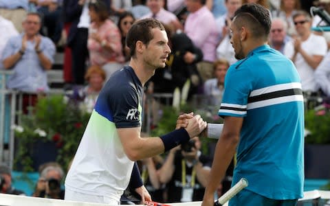 Andy Murray of Britain, left, shakes hands with Nick Kyrgios of Australia, right, after Kyrgios won their singles tennis match at the Queen's Club tennis tournament in London, Tuesday, June 19, 2018 - Credit: AP