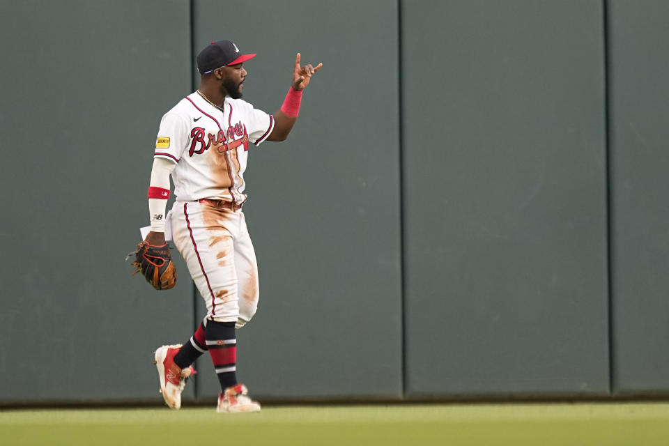 Atlanta Braves center fielder Michael Harris II celebrates after catching a fly ball hit by Philadelphia Phillies' Kyle Schwarber (12) in the second inning of a baseball game against the Atlanta Braves, Sunday, May 28, 2023, in Atlanta. (AP Photo/Brynn Anderson)