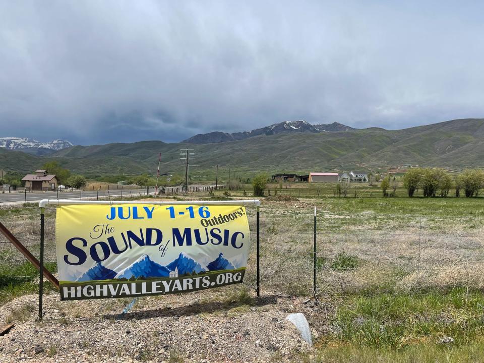 A sign advertises a "Sound of Music" event.