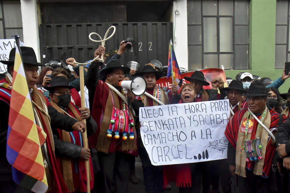 Opponents to Luis Fernando Camacho, governor of Santa Cruz, rally outside the police facility where he has been placed in custody, in La Paz, Bolivia, Thursday, Dec. 29, 2022. Camacho, the country's main opposition leader, was arrested Wednesday on terrorism charges. (AP Photo/Jose Lavayen)