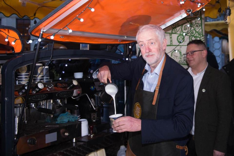 Labour leader Jeremy Corbyn works a shift on the Change Please coffee cart in Borough Market. (PA)