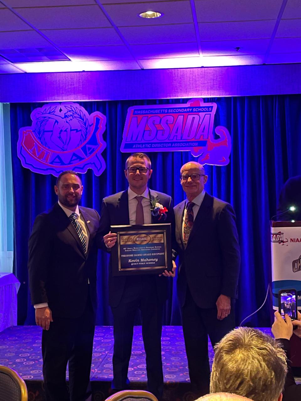 Kevin Mahoney receives the Ted Damko Award at the Massachusetts Secondary Schools Athletic Directors Association Conference last month.