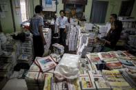 Staff members pack copies of the Thargi Nwe Thway journal promoting nationalism published by Ma Ba Tha to be delivered around the country at a warehouse at Ma Ba Tha's head office in Yangon August 26, 2015. REUTERS/Soe Zeya Tun