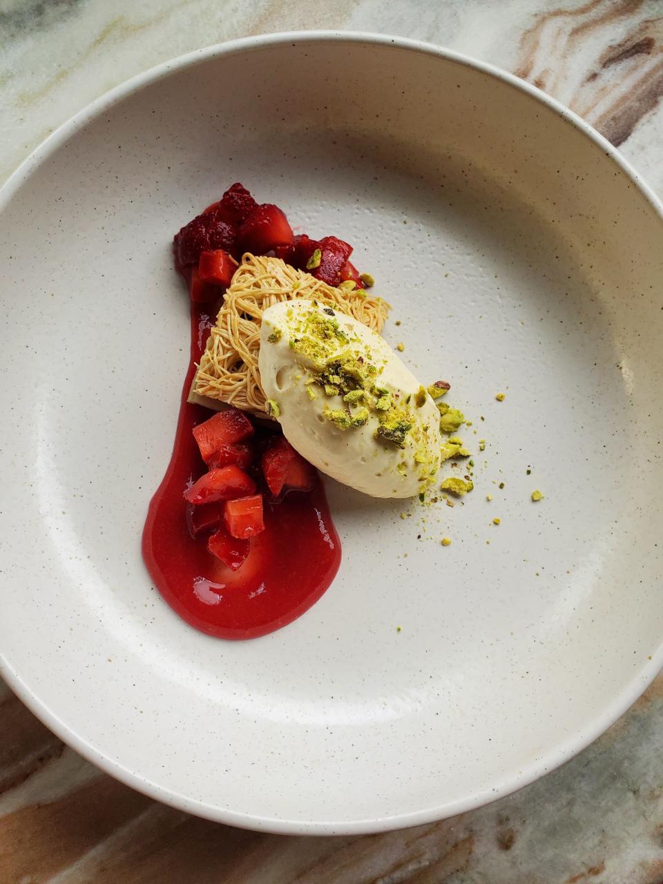 Tahini cheesecake with sesame baklava and Barr Farms strawberries at Paseo restaurant in Louisville.