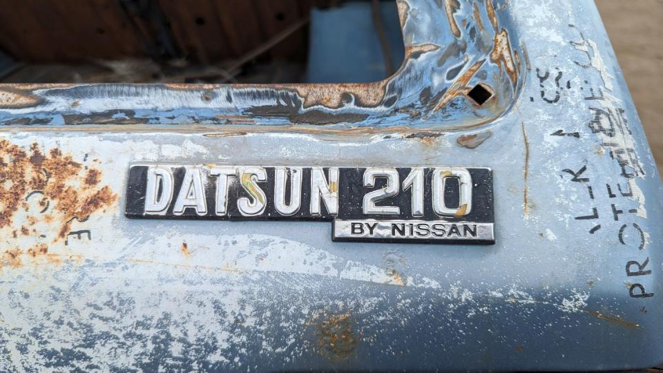 1980 datsun 210 wagon with 400k miles in colorado junkyard