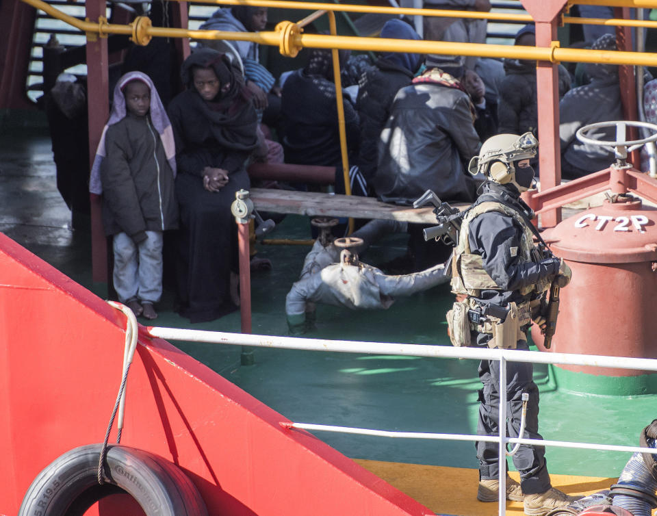 Armed forces stand onboard the Turkish oil tanker El Hiblu 1, which was hijacked by migrants, in Valletta, Malta, Thursday March 28, 2019. A Maltese special operations team on Thursday boarded a tanker that had been hijacked by migrants rescued at sea, and returned control to the captain, before escorting it to a Maltese port. (AP Photo/Rene' Rossignaud)