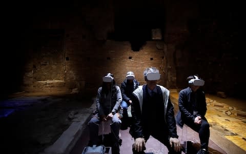 Virtual reality goggles bring the remains of the palace to life - Credit: Alessandra Tarantino/AP