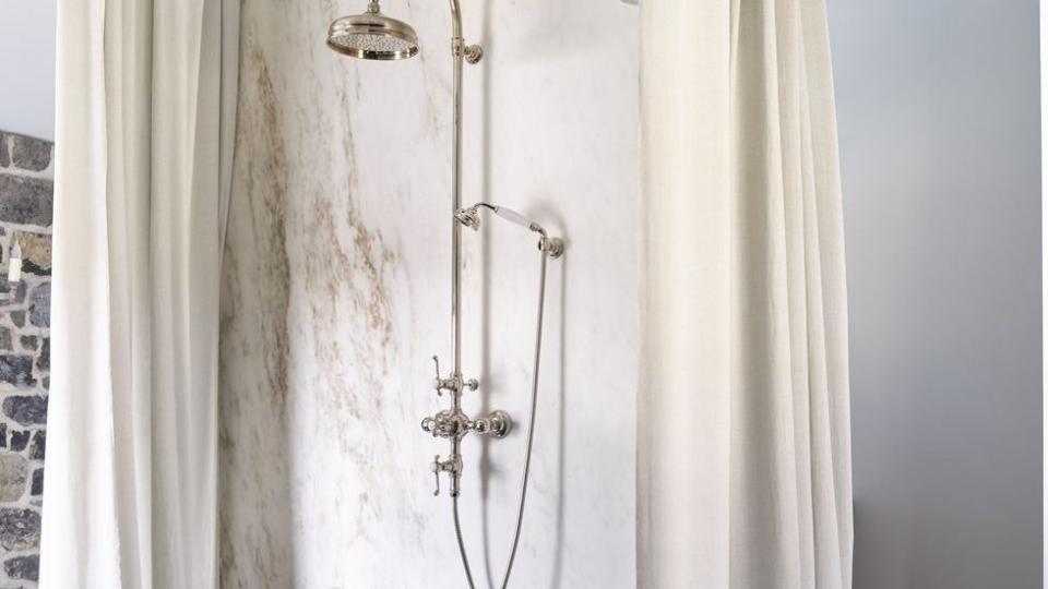 a shower curtain with a shower head