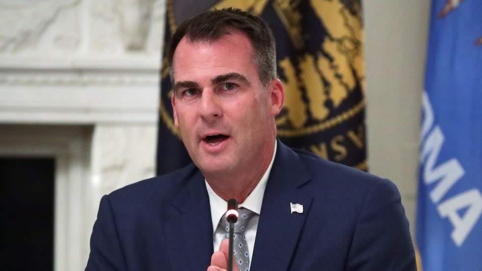 Oklahoma Gov. Kevin Stitt (R) participates in a White House roundtable with then-President Trump in 2020