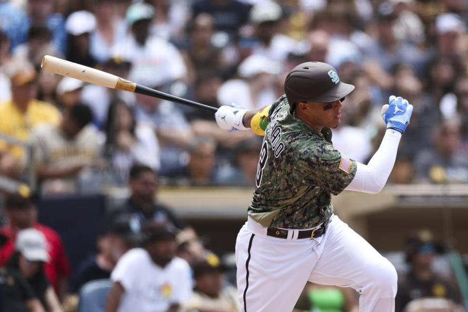 San Diego Padres' Manny Machado watches his rbi single against the Tampa Bay Rays in the fifth inning of a baseball game, Sunday, June 18, 2023, in San Diego. Trent Grisham scored on the play. (AP Photo/Derrick Tuskan)