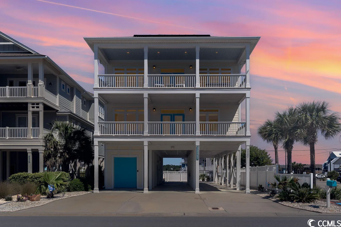 The home on 5207 N Ocean Blvd. sold for $1,499,999. The home is another ocean view vacation rental, and it comes with an elevator. The design of the outside is symmetrical, with every bedroom door leading to a balcony.