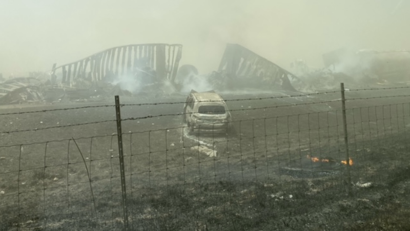 Burnt wreckage along an Interstate