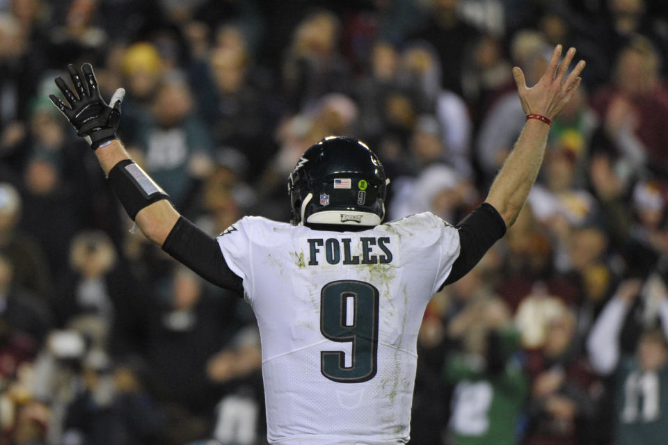 Philadelphia Eagles quarterback Nick Foles (9) reacts to wide receiver Nelson Agholor's touchdown during the second half of the NFL football game against the Washington Redskins, Sunday, Dec. 30, 2018 in Landover, Md. (AP Photo/Mark Tenally)