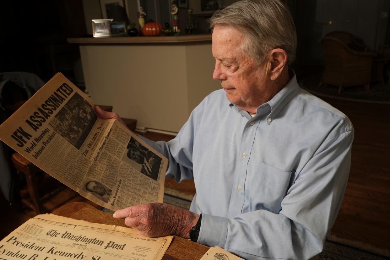 U.S. District Judge Tim Leonard has the Nov. 22-23, 1963, newspapers from The Daily Oklahoman, OKC Times, Oklahoma Daily, Washington Post and the Dallas Morning News on the Kennedy assassination. Leonard looks Friday at his copy of the Oklahoma Daily, the OU student newspaper.