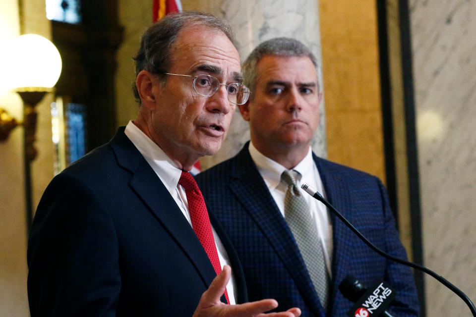 Lt. Gov. Delbert Hosemann, left, assures Mississippi citizens that "our lives are going to get back to normal. We will survive this," at a Tuesday, March 17, 2020, news conference in Jackson, Miss., during which both he and Speaker Philip Gunn, right, R-Clinton, discussed the plan to suspend the session and allow the legislature to resume when both men deem it appropriate and safe to return to the state Capitol, which has been closed to visitors because of the coronavirus outbreak.