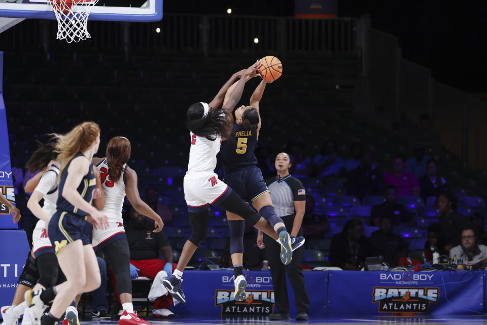 Mississippi's Marquesha Davis defends against Michigan's Laila Phelia (5) during an NCAA college basketball game in the Battle 4 Atlantis at Paradise Island, Bahamas, Monday, Nov. 20, 2023. (Tim Aylen/Bahamas Visual Services via AP)