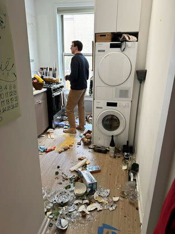 <p>Christine Covode</p> Ben Jardine standing in the kitchen after cabinets fall.