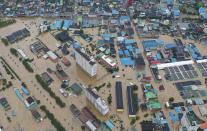 A village area is flooded due to heavy rain in Gurye, South Korea, Saturday, Aug. 8, 2020.(Chun Jung-in/Yonhap via AP)