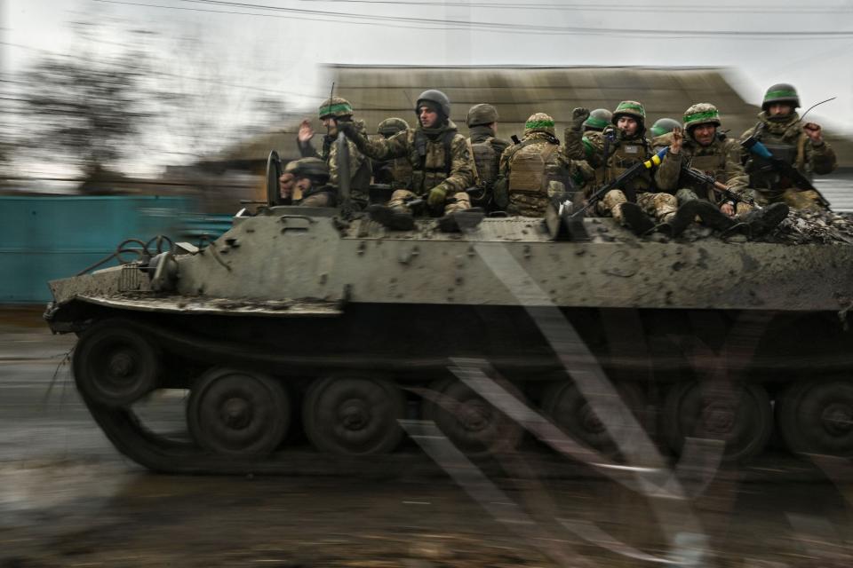 Ukrainian servicemen move towards the front line near the city of Bakhmut, on March 8, 2023.