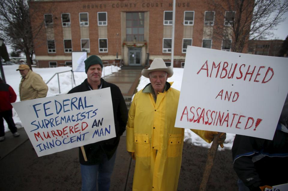 Clint Siegner (L) and his father Monte Siegner join other demonstrators during a protest outside the Harney County Court House in Burns, Oregon on Friday. (REUTERS/Jim Urquhart)