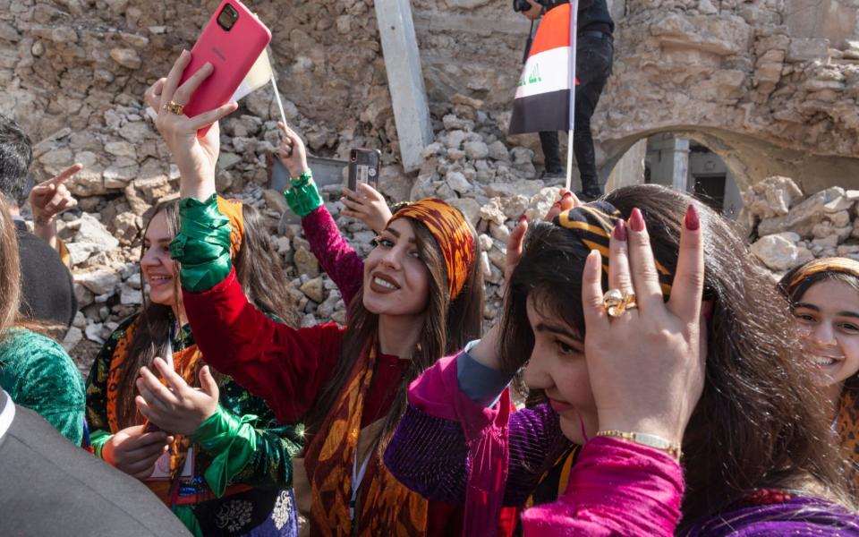 Members of the St. Yousef Choir of Karamles wait for the Pope's arrival - Sam Tarling for The Telegraph