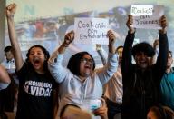 Members of Nicaragua's new National Coalition cheer as opposition parties sign a formal agreement to join forces to defeat leftist President Daniel Ortega in elections set for next year