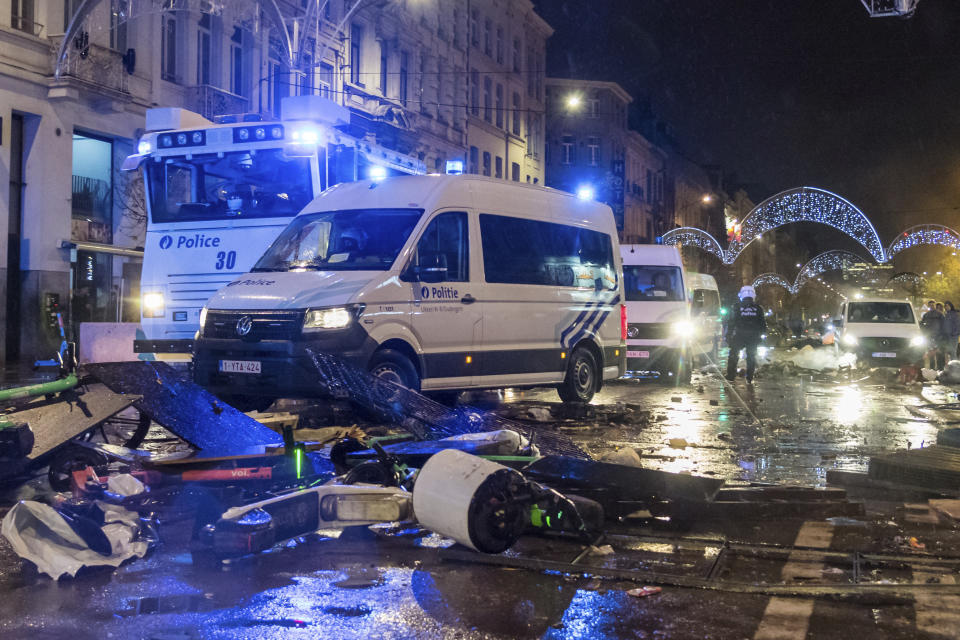 Police cars drive along a main boulevard in Brussels, Sunday, Nov. 27, 2022, as violence broke out during and after Morocco's 2-0 win over Belgium at the World Cup. Police had to seal off parts of the center of Brussels and moved in with water cannons and tear gas to disperse crowds. (AP Photo/Geert Vanden Wijngaert)