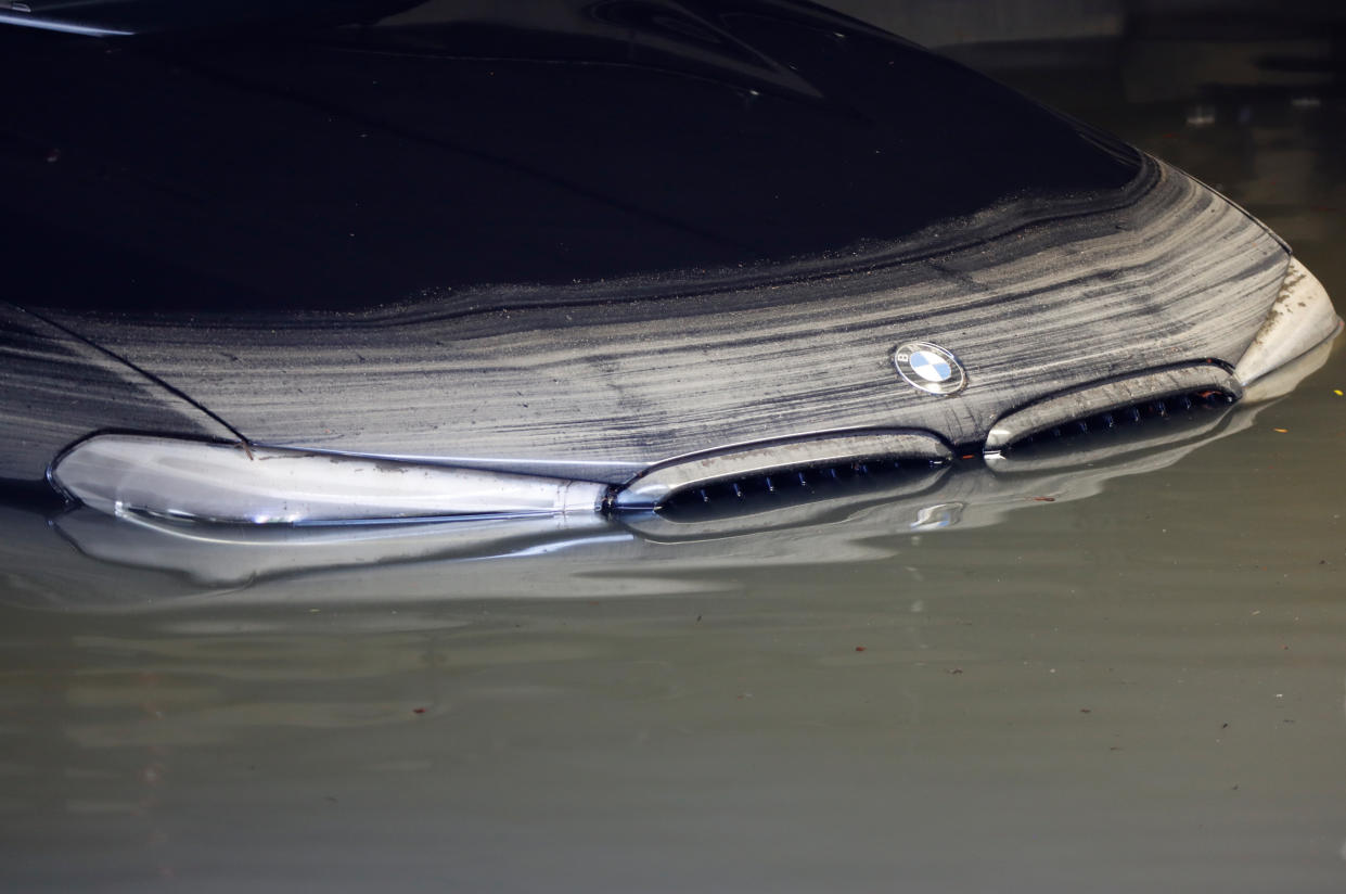 A car sits in a flooded garage in Hoboken, N.J., the morning after the remnants of Hurricane Ida drenched the Northeast. (Gary Hershorn/Getty Images)