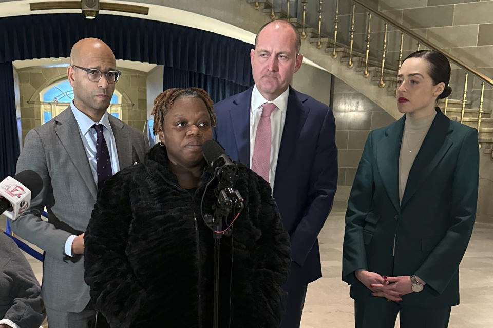 Oriel Moore describes life without her brother, 38-year-old Othel Moore Jr., to reporters, Tuesday, Dec. 19, 2023, at the Missouri Capitol building in Jefferson City, Mo. Four Missouri prison guards have been charged with murder, and a fifth with involuntary manslaughter, in his December 2023 death while he was in custody at the Jefferson City Correctional Center. (AP Photo/Summer Ballentine)