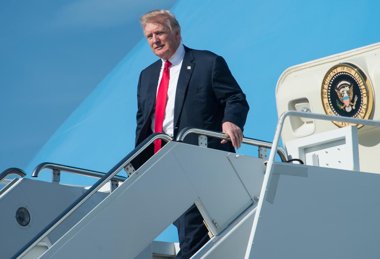 President Trump arrives at Palm Beach International Airport in Florida to spend the weekend at his Mar-a-Lago resort: AFP/Getty Images