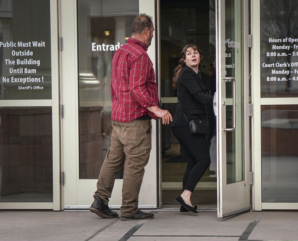 Hannah Gutierrez-Reed, right, arrives at the First Judicial District Courthouse in Santa Fe, N.M., on Wednesday, Feb. 21, 2024, for the start of her trial on charges of involuntary manslaughter and tampering with evidence. Prosecutors in New Mexico are pursuing accountability for the 2021 death of a cinematographer who was fatally shot by actor Alec Baldwin during a rehearsal for the Western film “Rust.” (Gabriela Campos/Santa Fe New Mexican via AP, Pool)