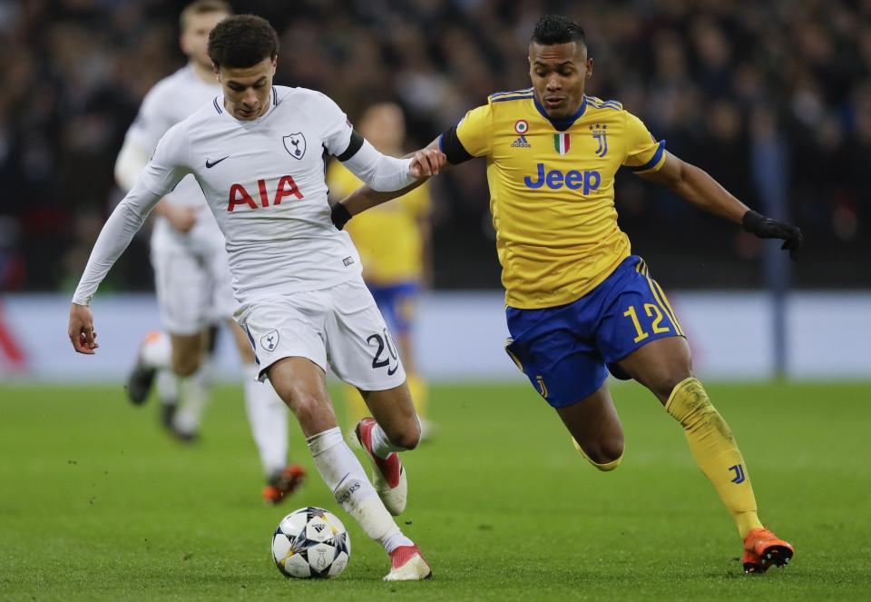 Tottenham’s Dele Alli, left, and Juventus’ Alex Sandro go for the ball during the Champions League, round of 16, second-leg soccer match between Juventus and Tottenham Hotspur, at the Wembley Stadium in London, Wednesday, March 7, 2018. (AP Photo/Kirsty Wigglesworth)