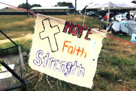 A flag is hanging near the First Baptist Church, the site of November 5 church shooting where a gunman killed 26 and wounded 20 in Sutherland Springs, Texas, U.S., November 11, 2017. REUTERS/Tim Reid