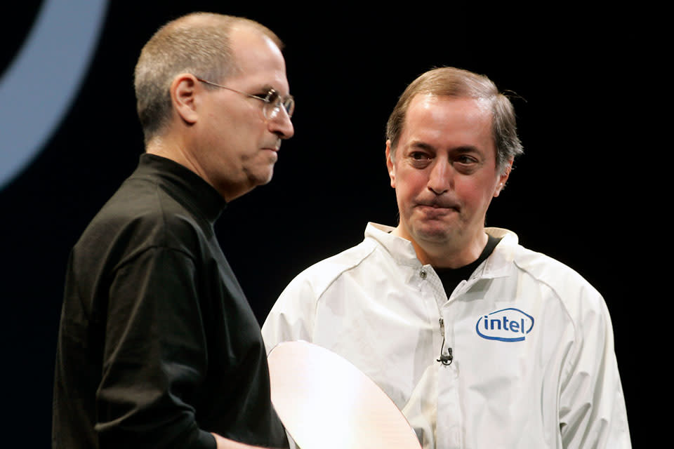 MACWORLD11_129_LH.JPG Apple Computer CEO Steve Jobs (left) announces using the Intel processor in Mac computers in his keynote speech at the Moscone Center. At right is CEO Paul Otellini of Intel. Photographed by Liz Hafalia on 1/10/06 in San Francisco, California. SFC Ran on: 01-11-2006 <a href="https://fortune.com/company/olin/" rel="nofollow noopener" target="_blank" data-ylk="slk:Olin;elm:context_link;itc:0;sec:content-canvas" class="link rapid-noclick-resp">Olin</a> Kahney, 9, of San Francisco helps to promote his father Leander's book &quo;The Cult of iPod&quo; at the Macworld Expo at Moscone Center. Ran on: 01-18-2006 CEO Paul Otellini delivers Intel chips to Apple Computer at the recent MacWorld Expo. (Photo By Liz Hafalia/The San Francisco Chronicle via Getty Images)