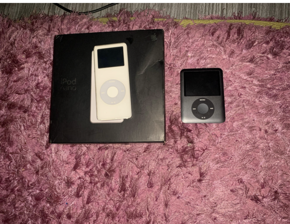 An iPod Nano next to another iPod