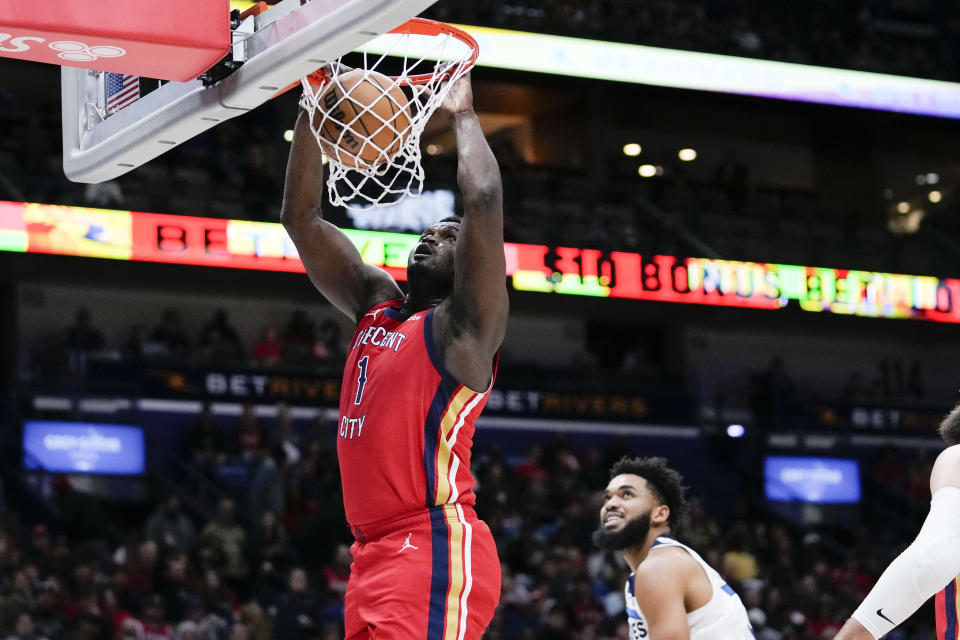 New Orleans Pelicans forward Zion Williamson (1) slam dunks in the first half of an NBA basketball game against the Minnesota Timberwolves in New Orleans, Monday, Dec. 11, 2023. (AP Photo/Gerald Herbert)