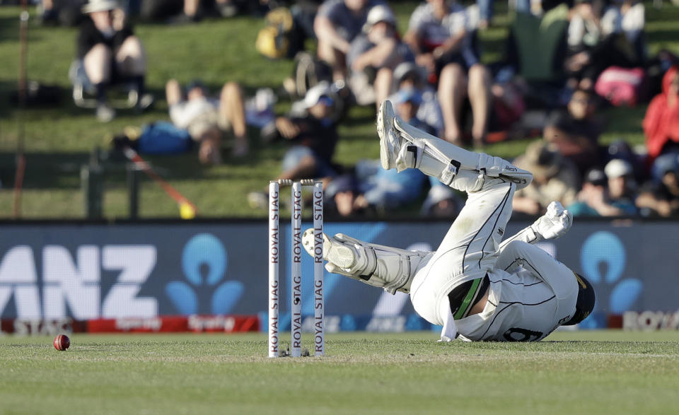 New Zealand's Tom Blundell falls after he was hit by the ball during play on day one of the second cricket test between New Zealand and India at Hagley Oval in Christchurch, New Zealand, Saturday, Feb. 29, 2020. (AP Photo/Mark Baker)