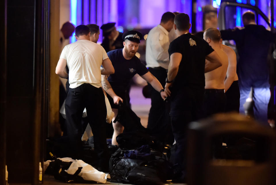 <p>Police officers get changed as they attend to an incident on London Bridge in London, Britain, June 3, 2017. (Reuters/Hannah McKay) </p>