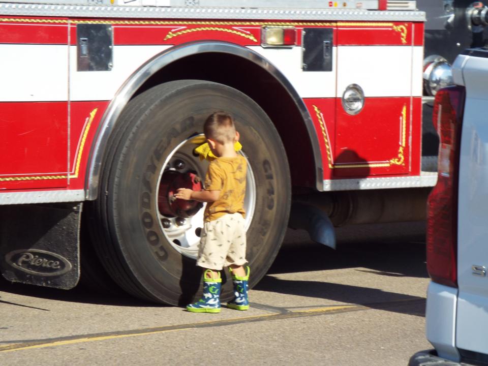 A little fireman helps get the fire truck ready for the Bent but Not Broken parade held Saturday morning in Perryton as part of this year's Wheatheart of the Nation celebration.