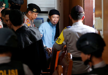 Islamic cleric Aman Abdurrahman leaves a court following his verdict in Jakarta, Indonesia, June 22, 2018. REUTERS/Darren Whiteside