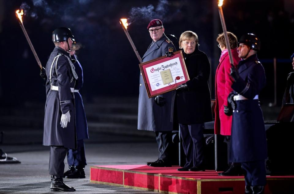 A brass band honoured Mrs Merkel by playing three songs of her choice (Getty Images)