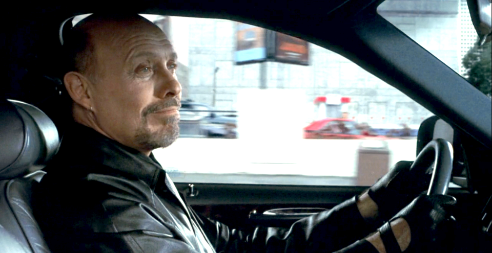 Hector Elizondo driving a car